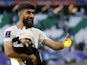 Ali Gholizadeh celebrates with his son as Iran defeated Japan at the 2023 Asian Cup